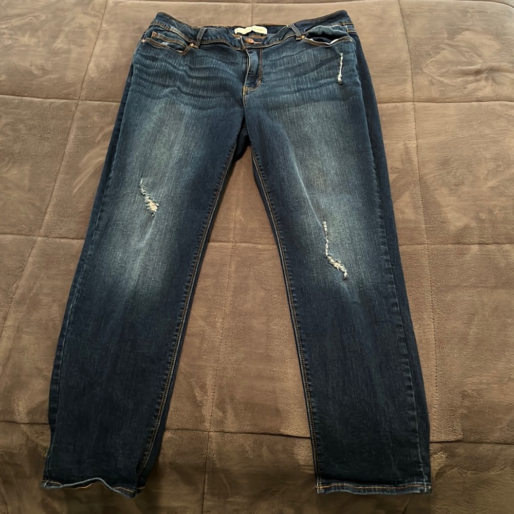 Slightly distressed, straight-legged blue jeans